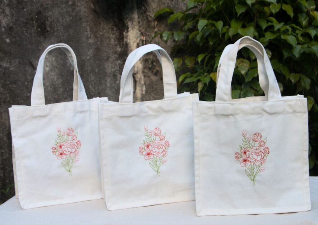 Floral embroidered cream bag for the purpose of gifting